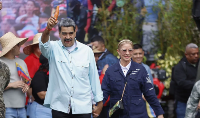 
Presiden Venezuela Nicolas Maduro dan istrinya menghadiri sebuah acara di Caracas, ibu kota Venezuela, Rabu (10/12/2025).