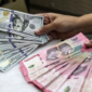 uang rupiah dan dolar AS di tengah sentimen global akibat konflik Iran dan pertemuan Xi Jinping dengan Donald Trump.